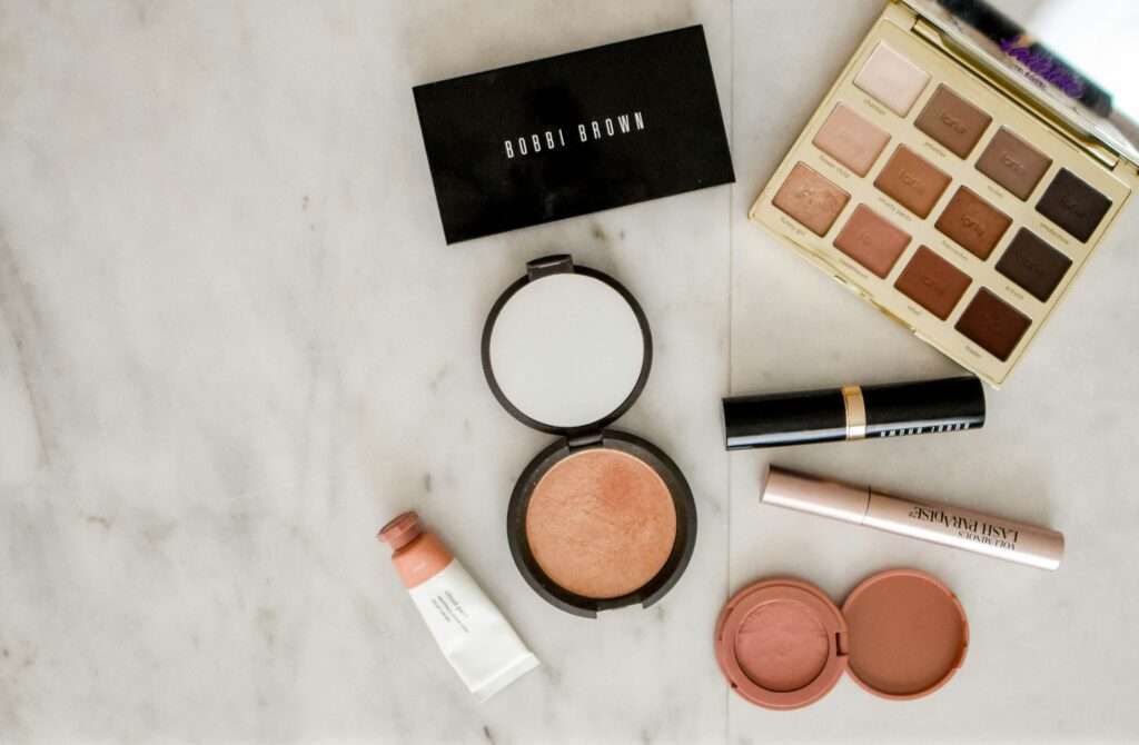 Image of makeup on granite counter top.