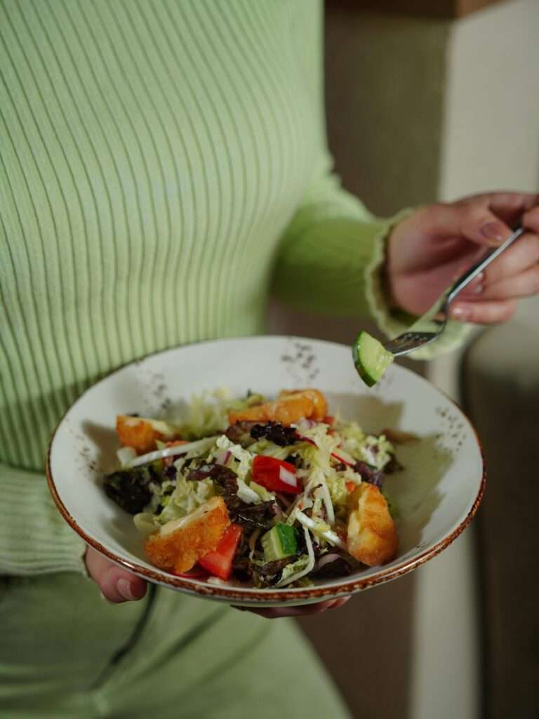 A woman eating salad