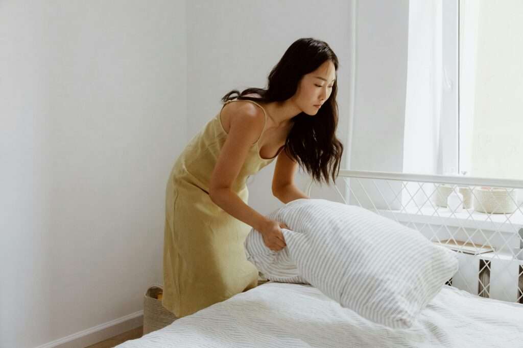 A woman making up her bed