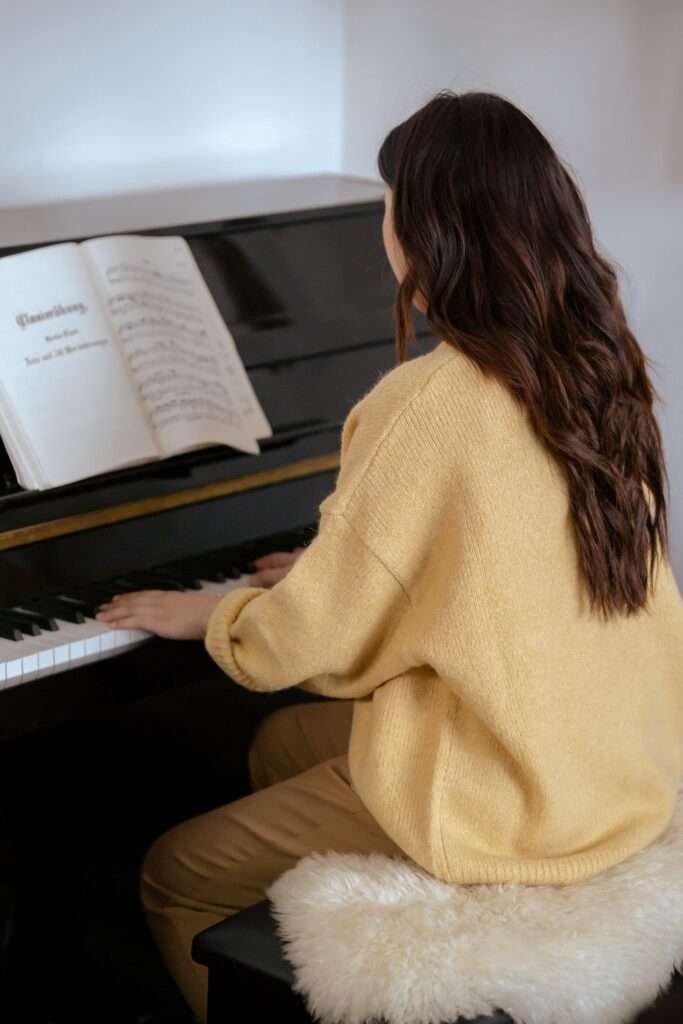 Image of a woman playing the piano