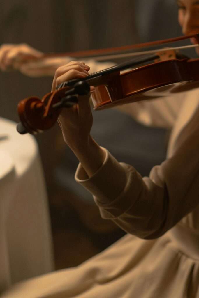 An image of a woman playing a violin