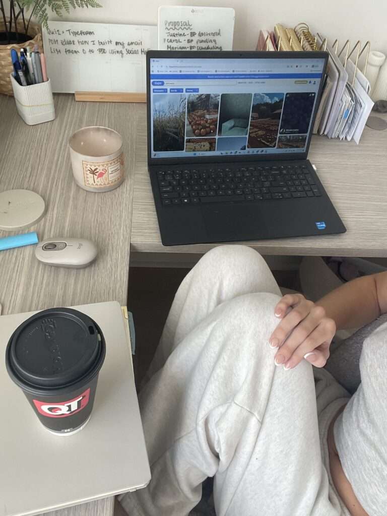 Image of a woman sitting by a desk.